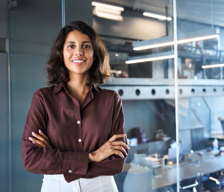 Portrait,Of,Beautiful,Successful,Hispanic,Young,Business,Woman,With,Crossed